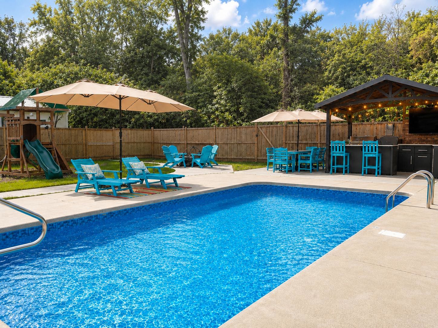 Private pool, lounge chairs, and outdoor kitchen at Casa Amaris